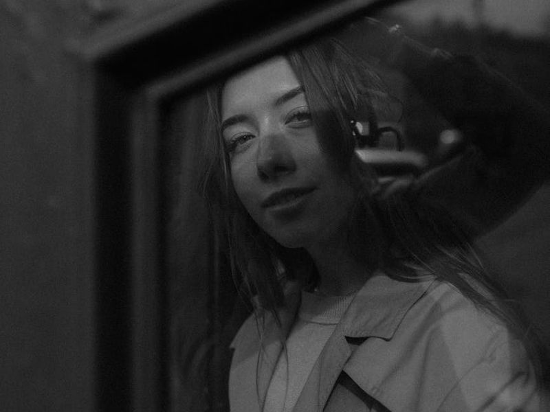 A person looking into the distance with a focused expression.